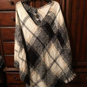 Tan, black, and cream poncho sweater